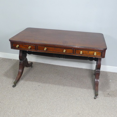 466 - A William IV mahogany and rosewood Library Table, the rectangular rounded top with rosewood banding,... 