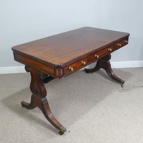 466 - A William IV mahogany and rosewood Library Table, the rectangular rounded top with rosewood banding,... 