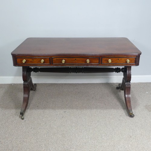 466 - A William IV mahogany and rosewood Library Table, the rectangular rounded top with rosewood banding,... 