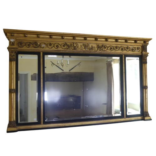 467 - A Regency carved giltwood and ebonised triptych overmantle Mirror, the moulded cornice with applied ... 