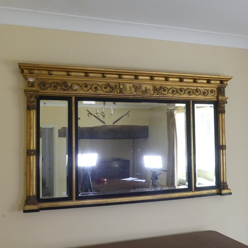 467 - A Regency carved giltwood and ebonised triptych overmantle Mirror, the moulded cornice with applied ... 