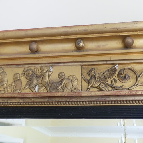 467 - A Regency carved giltwood and ebonised triptych overmantle Mirror, the moulded cornice with applied ... 