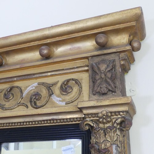 467 - A Regency carved giltwood and ebonised triptych overmantle Mirror, the moulded cornice with applied ... 