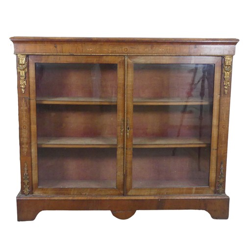 470 - A Victorian walnut and inlaid glazed Bookcase, moulded top over inlaid frieze, above two gilt metal ... 