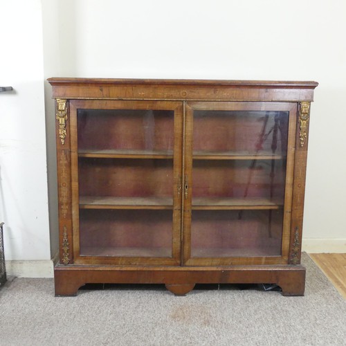 470 - A Victorian walnut and inlaid glazed Bookcase, moulded top over inlaid frieze, above two gilt metal ... 