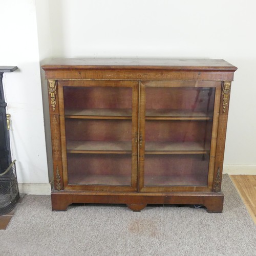 470 - A Victorian walnut and inlaid glazed Bookcase, moulded top over inlaid frieze, above two gilt metal ... 