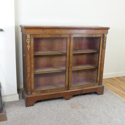 470 - A Victorian walnut and inlaid glazed Bookcase, moulded top over inlaid frieze, above two gilt metal ... 