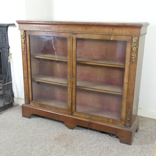 470 - A Victorian walnut and inlaid glazed Bookcase, moulded top over inlaid frieze, above two gilt metal ... 