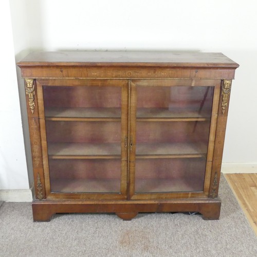 470 - A Victorian walnut and inlaid glazed Bookcase, moulded top over inlaid frieze, above two gilt metal ... 