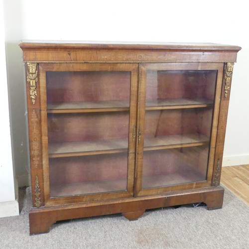 470 - A Victorian walnut and inlaid glazed Bookcase, moulded top over inlaid frieze, above two gilt metal ... 