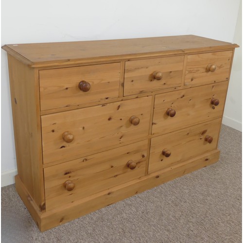 472 - A contemporary pine Chest of drawers, three short drawers over four long drawers, raised on plinth b... 