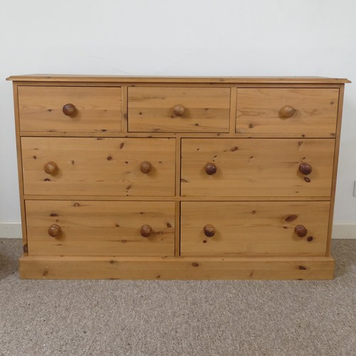 472 - A contemporary pine Chest of drawers, three short drawers over four long drawers, raised on plinth b... 