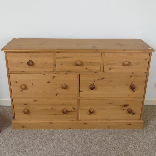 472 - A contemporary pine Chest of drawers, three short drawers over four long drawers, raised on plinth b... 