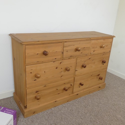 472 - A contemporary pine Chest of drawers, three short drawers over four long drawers, raised on plinth b... 