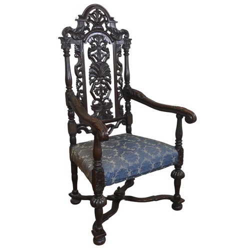 473 - A Victorian Carolean style Armchair, heavily carved and pierced backrest decorated with shells and s... 