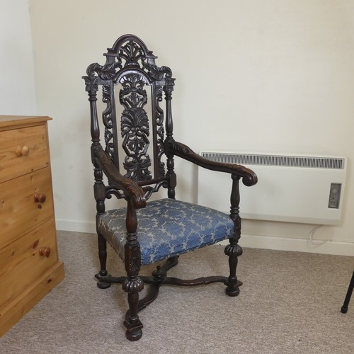 473 - A Victorian Carolean style Armchair, heavily carved and pierced backrest decorated with shells and s... 