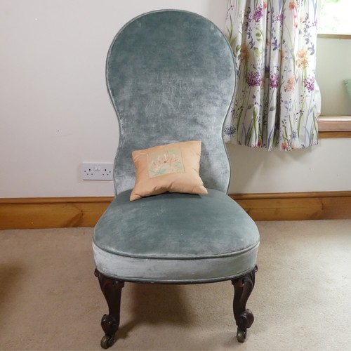 474 - A Victorian upholstered nursing Chair, with shaped backrest, raised on carved cabriole supports, W 5... 