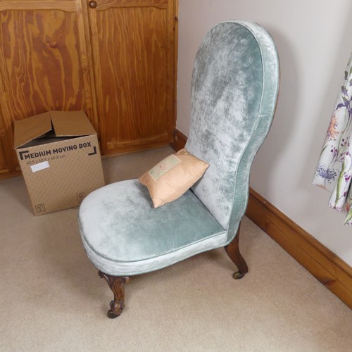 474 - A Victorian upholstered nursing Chair, with shaped backrest, raised on carved cabriole supports, W 5... 