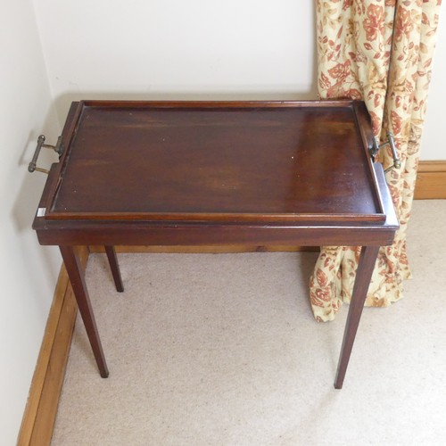 479 - A 20th century mahogany folding butlers Table, with gallery and brass carrying handles to either end... 