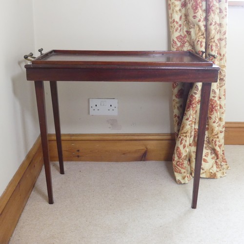 479 - A 20th century mahogany folding butlers Table, with gallery and brass carrying handles to either end... 