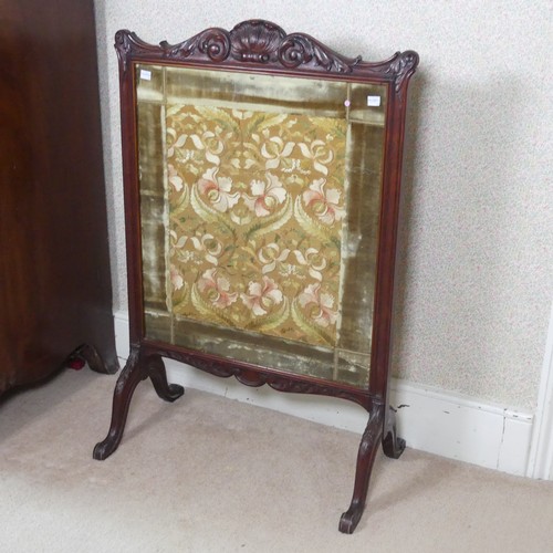 480 - A Victorian carved mahogany framed fire Screen, raised on splayed legs, W 64 cm x H 94 cm x D 36 cm.... 