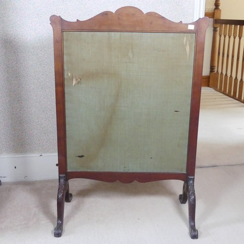 480 - A Victorian carved mahogany framed fire Screen, raised on splayed legs, W 64 cm x H 94 cm x D 36 cm.... 