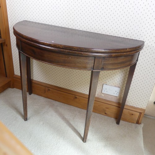 482 - A Georgian mahogany demi-lune card Table, folding top raised on four tapering supports, W 97 cm x H ... 