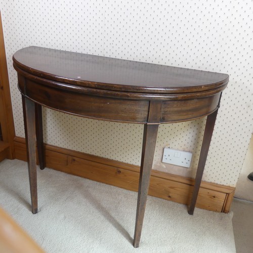 482 - A Georgian mahogany demi-lune card Table, folding top raised on four tapering supports, W 97 cm x H ... 