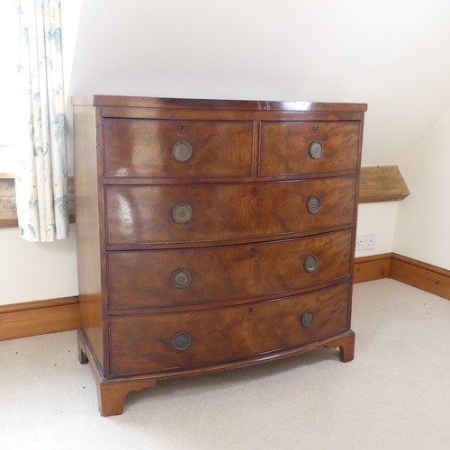 484 - A George III mahogany bow-fronted Chest of drawers, of two short drawers over three long drawers, ra... 