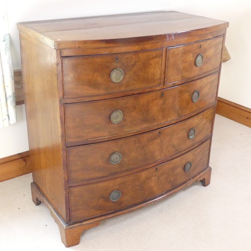 484 - A George III mahogany bow-fronted Chest of drawers, of two short drawers over three long drawers, ra... 