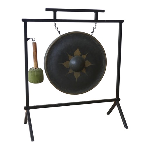 487 - A vintage Aesthetic inspired metal dinner Gong, with central decorated circular gong, and beater, W ... 