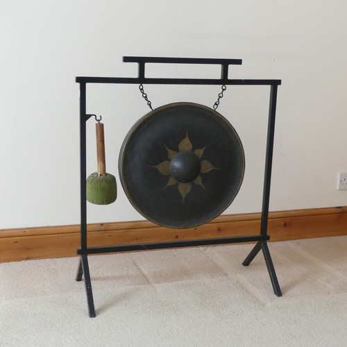 487 - A vintage Aesthetic inspired metal dinner Gong, with central decorated circular gong, and beater, W ... 