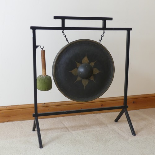 487 - A vintage Aesthetic inspired metal dinner Gong, with central decorated circular gong, and beater, W ... 