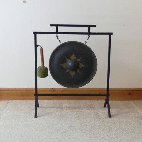 487 - A vintage Aesthetic inspired metal dinner Gong, with central decorated circular gong, and beater, W ... 