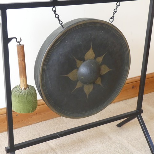 487 - A vintage Aesthetic inspired metal dinner Gong, with central decorated circular gong, and beater, W ... 