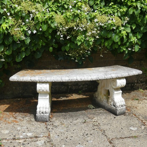 488 - A reconstituted stone garden Seat, of curved form raised on plinths, note split to underside, which ... 