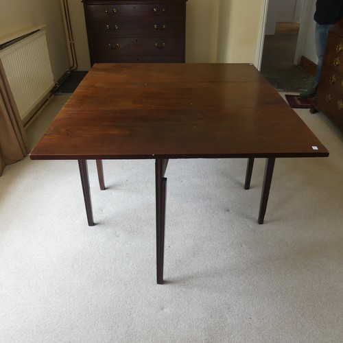 498 - A 19th century mahogany gateleg Table, raised in reeded tapering legs, W 138 cm x H 72 cm x D 108 cm... 