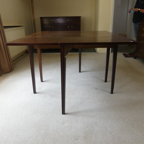 498 - A 19th century mahogany gateleg Table, raised in reeded tapering legs, W 138 cm x H 72 cm x D 108 cm... 