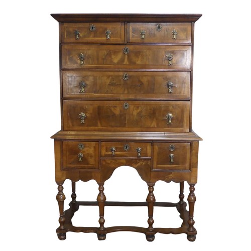 499 - A Georgian style walnut veneered Chest on stand, the 18th century top with moulded cornice over two ... 