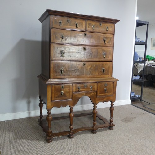 499 - A Georgian style walnut veneered Chest on stand, the 18th century top with moulded cornice over two ... 