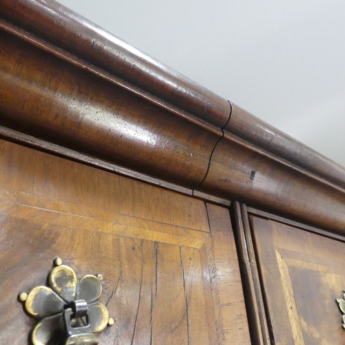 499 - A Georgian style walnut veneered Chest on stand, the 18th century top with moulded cornice over two ... 