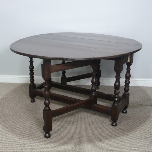 501 - A Georgian oak gateleg Table, raised on turned supports, W 128.5 cm x H 75 cm x D 148 cm.... 