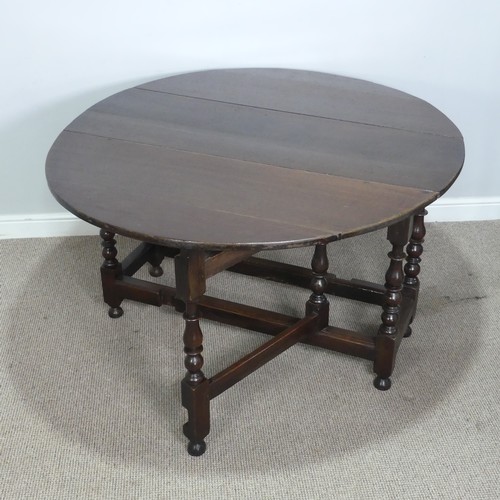 501 - A Georgian oak gateleg Table, raised on turned supports, W 128.5 cm x H 75 cm x D 148 cm.... 