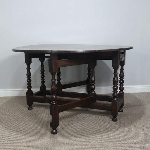 501 - A Georgian oak gateleg Table, raised on turned supports, W 128.5 cm x H 75 cm x D 148 cm.... 