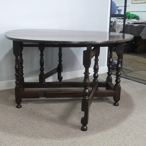 501 - A Georgian oak gateleg Table, raised on turned supports, W 128.5 cm x H 75 cm x D 148 cm.... 