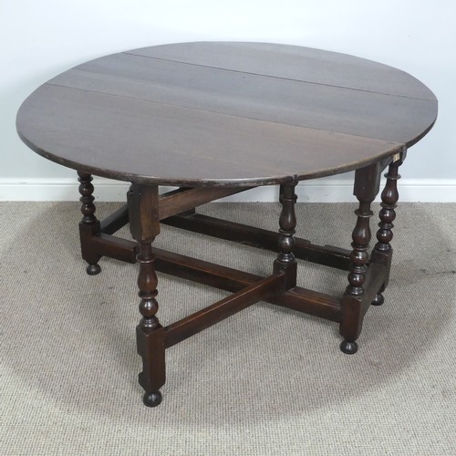 501 - A Georgian oak gateleg Table, raised on turned supports, W 128.5 cm x H 75 cm x D 148 cm.... 