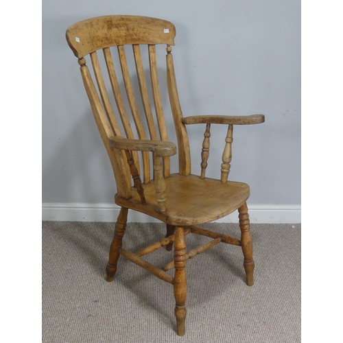 508 - A late 19th century ash and elm Windsor Armchair, shaped headrest over stick-back, raised on scrolle... 