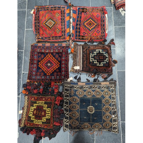 549 - Tribal Rugs: a Belouch Camel Bag, 104cm x 52cm, together with three smaller tent bags, and one hangi... 