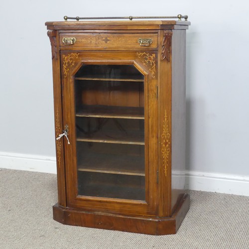 514 - A Victorian walnut inlaid music / display Cabinet, three quarter gallery over glazed door, raised on... 