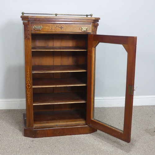 514 - A Victorian walnut inlaid music / display Cabinet, three quarter gallery over glazed door, raised on... 